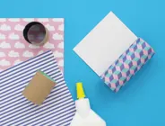 Toilet paper tubes wrapped in colourful, patterned wrapping paper, cut to size  and secured with PVA glue.